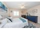 Spacious bedroom with a white bed frame and blue accents at 400 64Th Ave # 704, St Pete Beach, FL 33706