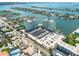 Aerial view of waterfront property with two towers, parking and boat slips at 400 64Th Ave # 704, St Pete Beach, FL 33706