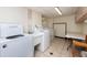 Shared laundry room with washers, dryers and folding table at 400 64Th Ave # 704, St Pete Beach, FL 33706