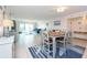 Casual dining area with table and chairs, near living room at 400 64Th Ave # 704, St Pete Beach, FL 33706