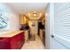 Small galley kitchen with wood cabinets and colorful backsplash at 400 64Th Ave # 704, St Pete Beach, FL 33706