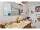 Bathroom with double sinks, decorative mirrors, and a shower/tub combo at 3520 Leslie West Rd, Dover, FL 33527