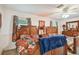 Spacious bedroom featuring two beds, stylish decor, and a ceiling fan for added comfort at 3520 Leslie West Rd, Dover, FL 33527