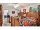 Large bedroom showcasing two beds, nightstands, and complementary floral accents throughout the room at 3520 Leslie West Rd, Dover, FL 33527