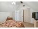Upstairs bedroom with closet and television at 3520 Leslie West Rd, Dover, FL 33527