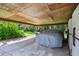 Carport featuring a golf cart and covered car, providing convenient storage solutions at 3520 Leslie West Rd, Dover, FL 33527