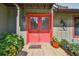 Inviting front entry with double doors, tiled porch, and decorative potted plants, creating a warm welcome at 3520 Leslie West Rd, Dover, FL 33527