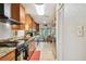 Bright kitchen with stainless steel appliances and granite countertops, leading to a breakfast nook with a view at 3520 Leslie West Rd, Dover, FL 33527