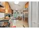 View of eat-in kitchen area with stainless steel appliances and granite countertops with ample storage at 3520 Leslie West Rd, Dover, FL 33527