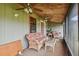 Spacious lanai with rattan furniture, including a sofa and chairs under a wood ceiling at 3520 Leslie West Rd, Dover, FL 33527