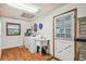 Well-lit laundry room featuring white appliances and paneling, complemented by a convenient utility sink at 3520 Leslie West Rd, Dover, FL 33527