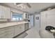 Modern white kitchen with stainless steel appliances at 100 Bluff View Dr # 404A, Belleair Bluffs, FL 33770