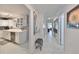 Bright entryway with view into kitchen and living spaces at 100 Bluff View Dr # 404A, Belleair Bluffs, FL 33770
