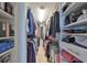 Large walk-in closet with built-in shelving and ample storage at 100 Bluff View Dr # 404A, Belleair Bluffs, FL 33770