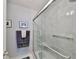 Clean bathroom with a walk-in shower and stylish accents at 100 Bluff View Dr # 404A, Belleair Bluffs, FL 33770