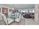 Bright dining area with glass table and seating for four at 100 Bluff View Dr # 404A, Belleair Bluffs, FL 33770