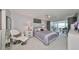 Relaxing bedroom with water views and private balcony access at 100 Bluff View Dr # 404A, Belleair Bluffs, FL 33770