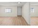 Spacious living area with light wood-look floors and an open floor plan at 8738 N Tangerine Pl, Tampa, FL 33617