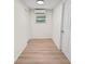 Simple bedroom with vinyl flooring and a window at 8738 N Tangerine Pl, Tampa, FL 33617