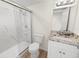 Updated bathroom with granite vanity and shower at 8738 N Tangerine Pl, Tampa, FL 33617