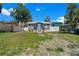 Quaint bungalow-style home with a newly landscaped yard at 8738 N Tangerine Pl, Tampa, FL 33617