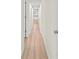 Light and bright hallway with wood-look flooring at 8738 N Tangerine Pl, Tampa, FL 33617