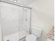 Updated bathroom with a large shower and marble-look tile at 8738 N Tangerine Pl, Tampa, FL 33617