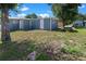 Backyard with storage shed and a picnic table at 8738 N Tangerine Pl, Tampa, FL 33617