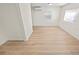 Second bedroom with light wood-look flooring and neutral walls at 8738 N Tangerine Pl, Tampa, FL 33617