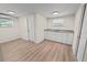 Small kitchen with white cabinets and granite countertops at 8738 N Tangerine Pl, Tampa, FL 33617