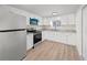 Modern kitchen with white shaker cabinets and granite countertops at 8738 N Tangerine Pl, Tampa, FL 33617
