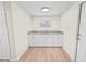 Compact kitchen with white cabinets and granite countertops at 8738 N Tangerine Pl, Tampa, FL 33617