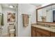 Bathroom with granite vanity, large mirror, and toilet at 3520 Leslie West Rd, Dover, FL 33527