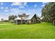 A-frame style home with metal roof and screened gazebo at 3520 Leslie West Rd, Dover, FL 33527
