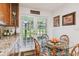 Kitchen features a breakfast nook and french doors to the backyard at 3520 Leslie West Rd, Dover, FL 33527
