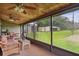 Enjoy the view from this screened porch overlooking the backyard at 3520 Leslie West Rd, Dover, FL 33527