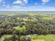 Aerial view of a house and expansive property with lush green landscape at 3520 Leslie West Rd, Dover, FL 33527