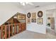 Loft area with stained glass window and multiple framed pictures at 3520 Leslie West Rd, Dover, FL 33527