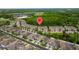 Community aerial view highlighting the location of the property, near a green area at 10066 Corso Milano Dr, Tampa, FL 33625