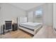 Bedroom features hardwood floors, a large window, and a desk, perfect for an office at 10066 Corso Milano Dr, Tampa, FL 33625
