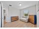 Bright, spacious bedroom with wood floors, nice dressers and an entrance to another room at 10066 Corso Milano Dr, Tampa, FL 33625