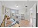 Bright bedroom with wood floors, desk, and a bed with stairway access to the upper mattress at 10066 Corso Milano Dr, Tampa, FL 33625