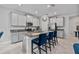 Bright kitchen with granite countertops, stainless steel appliances, and a kitchen island with seating at 10066 Corso Milano Dr, Tampa, FL 33625