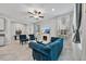 Cozy living room featuring a fireplace, comfortable seating, and large windows at 10066 Corso Milano Dr, Tampa, FL 33625