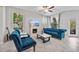 Comfortable living room featuring a fireplace, plush seating, and abundant natural light at 10066 Corso Milano Dr, Tampa, FL 33625