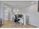 Bright, spacious office with modern desk, three monitors, and comfortable chair on the way to a bedroom at 10066 Corso Milano Dr, Tampa, FL 33625