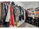 Well-organized walk-in closet with shelving, clothing racks, shoe storage, and space for accessories at 10066 Corso Milano Dr, Tampa, FL 33625