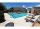 Inviting community pool with lounge chairs and ample space for recreation at 10066 Corso Milano Dr, Tampa, FL 33625