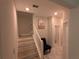 Upstairs hall with stairs, bathroom and seating area at 10066 Corso Milano Dr, Tampa, FL 33625