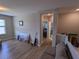 Hardwood floor hallway with access to bedrooms and bathroom at 10066 Corso Milano Dr, Tampa, FL 33625